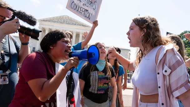 PHOTO: An anti-abortion demonstrator, left, argues with an abortion-rights activist outside the Supreme Court in Washington, June 25, 2022. (Jose Luis Magana/AP)