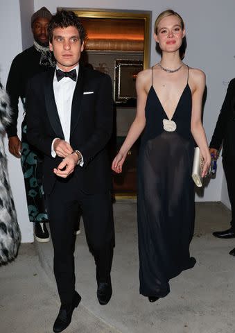 <p>Rachpoot/Bauer-Griffin/GC Images</p> Gus Wenner and Elle Fanning are seen arriving to Vas Morgan And Michael Brown's 2024 Golden Globe Awards Party on January 07, 2024.