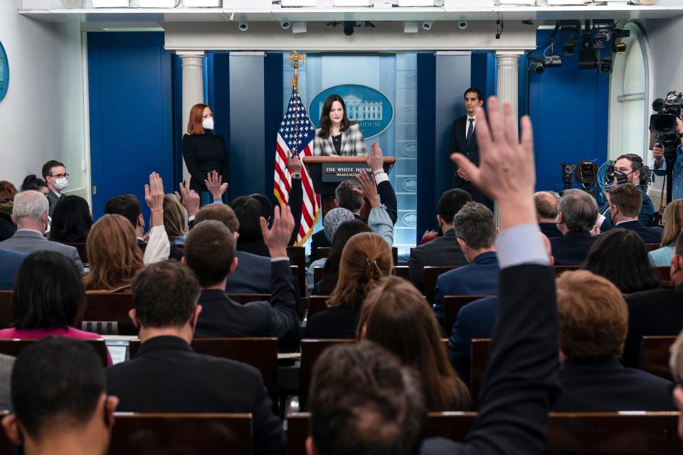 Anne Neuberger, Deputy National Security Advisor for Cyber and Emerging Technology, center, speaks with reporters in the James Brady Press Briefing Room at the White House, on Feb. 18, 2022, in Washington. White House press secretary Jen Psaki, left, and Daleep Singh, Deputy National Security Advisor for International Economics, right, look on.