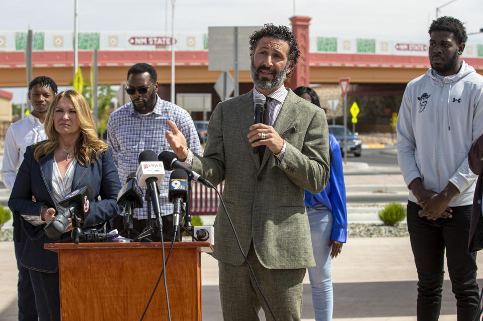 Ramez Shamieh, attorney representing former New Mexico State NCAA college basketball player Shak Odunewu, far right, and Joleen Youngers, second left, attorney representing former player Deuce Benjamin and his father William Benjamin, seen in the background, conduct a news conference in Las Cruces, N.M., Wednesday, May 3, 2023. The Benjamins and Odunewu discussed the lawsuit they filed alleging teammates ganged up and sexually assaulted them multiple times, while their coaches and others at the school didn't act when confronted with the allegations. (AP Photo/Andres Leighton)