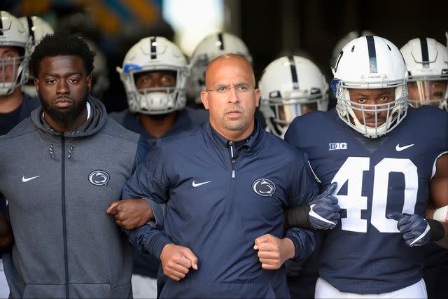 <p>Randy Litzinger/Icon Sportswire via Getty</p> Penn State head coach James Franklin leads the team out the tunnel and onto the field