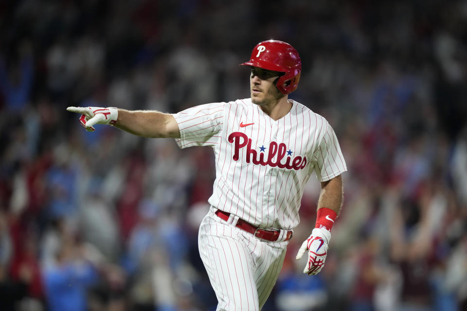 Philadelphia Phillies' J.T. Realmuto reacts after hitting a three-run home run against New York Mets pitcher Tylor Megill during the sixth inning of a baseball game, Friday, Sept. 22, 2023, in Philadelphia. (AP Photo/Matt Slocum)