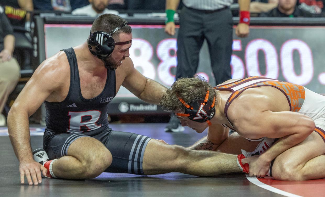 Rutgers' John Poznanski (left), shown during his 4-2 win over Virginia Tech's Andy Smith on Nov. 17, will likely wrestle Luke Stout when the Scarlet Knights host Princeton Friday night.