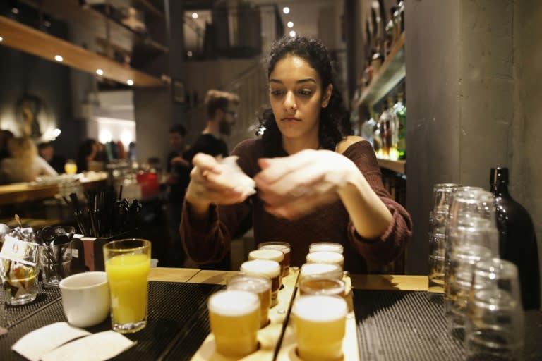 A bartender serves beer at the Libira Brewery pub in the northern Israeli city of Haifa