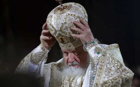 Patriarch Kirill serves the Christmas Mass in the Christ the Savior Cathedral in Moscow, Russia - Credit: AP