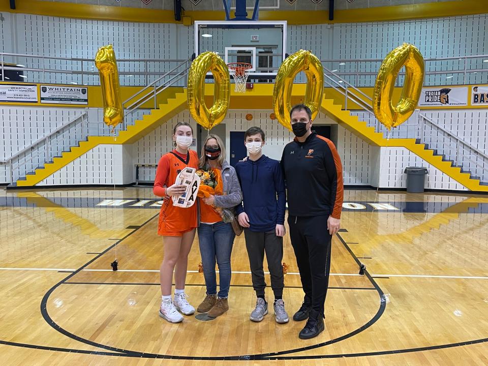 Pennsbury's Ava Sciolla recently scored her 1,000th career point. She's pictured here with her mom, Amanda, brother Dante and father Frank.