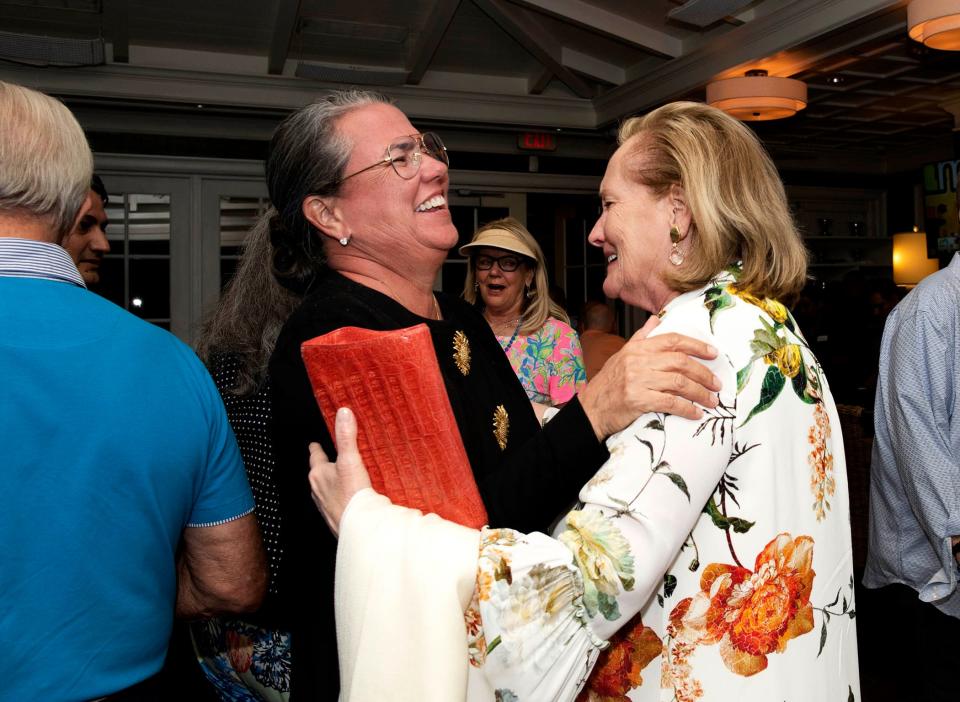 Outgoing Palm Beach Town Council President Margaret Zeidman, right, congratulates Bridget Moran at Al Fresco Tuesday following her victory in the Group 3 town council race. Moran defeated John David Corey to claim Zeidman's seat.