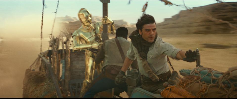 C-3PO (Anthony Daniels, from left) holds on for dear life alongside Finn (John Boyega) and Poe Dameron (Oscar Isaac) in "The Rise of Skywalker."