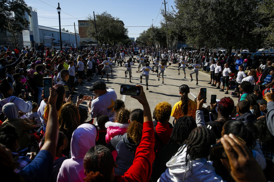 In this Monday, Jan. 15, 2018 photo, the Isiserettes perform during a break in the MLK Grande Parade in Houston. For more than two decades, competing MLK Day parades have been held in Houston. This year, the city of Houston threw its official support behind one parade, the 41st annual “Original” MLK, Jr. Parade, hoping the city could unite behind only one parade. But organizers of the other parade, the 25th annual MLK Grande Parade, will still be holding its event and they say they have no plans to stop having their own parade.(Michael Ciaglo/Houston Chronicle via AP)