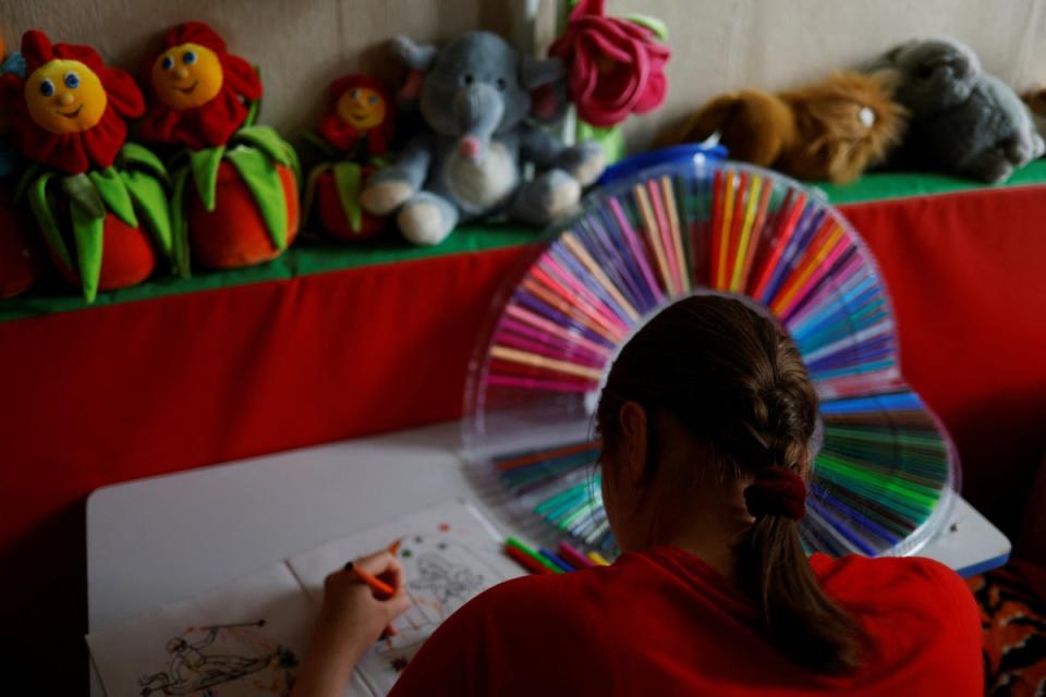 Olga Slivka, 18, takes part in an activity session at the orphanage (Reuters)