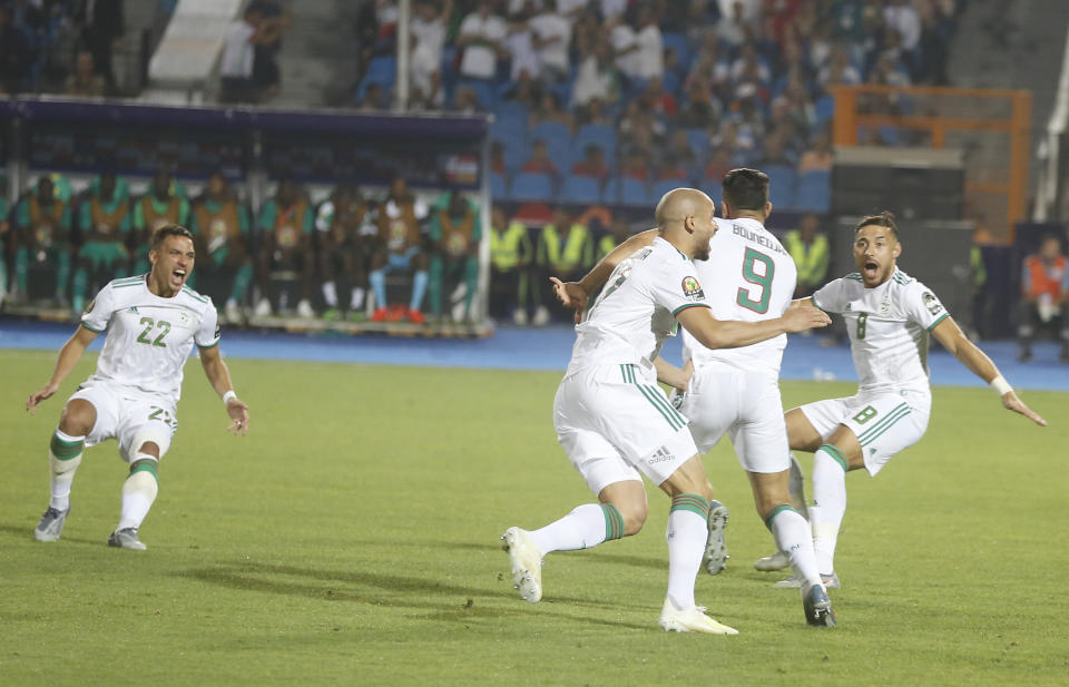 Algerian players celebrate after a goal during the African Cup of Nations final soccer match between Algeria and Senegal in Cairo International stadium in Cairo, Egypt, Friday, July 19, 2019. (AP Photo/Amr Nabil)