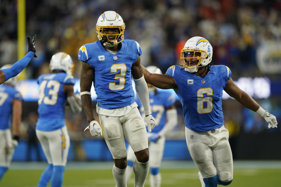 Los Angeles Chargers safety Derwin James Jr. (3) celebrates with linebacker Eric Kendricks after stopping the Chicago Bears on a fourth down play during the second half of an NFL football game Sunday, Oct. 29, 2023, in Inglewood, Calif. (AP Photo/Ryan Sun)