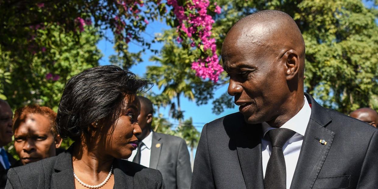 Jovenel Moise looks at  Martine Moise