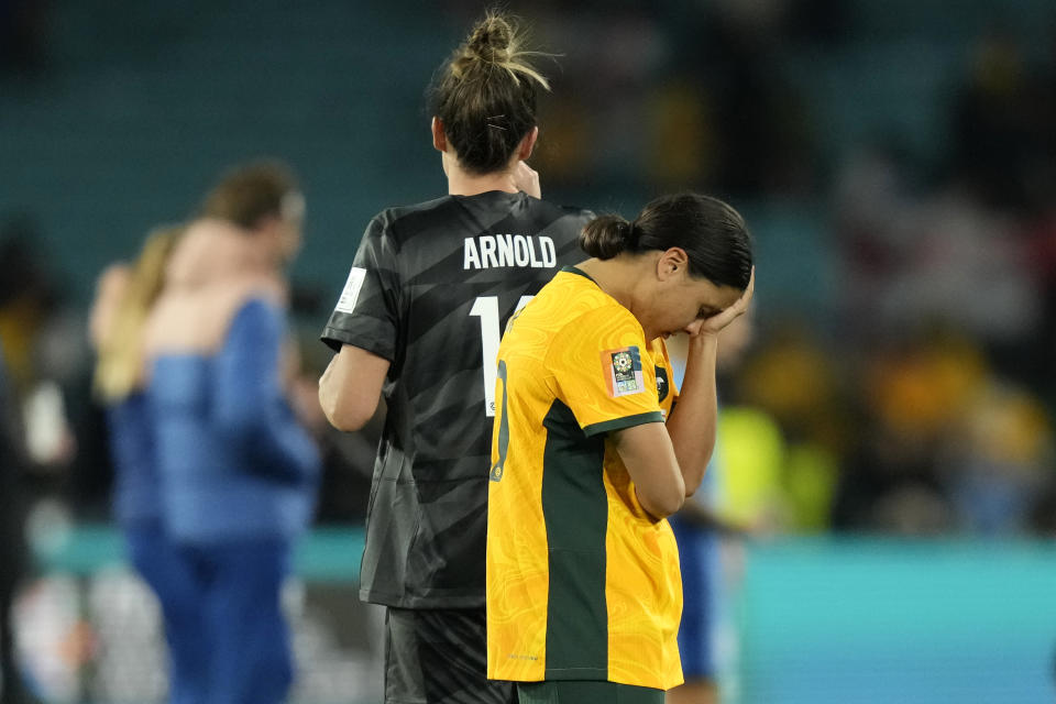 Australia's captain Sam Kerr, right, reacts after their loss in the Women's World Cup semifinal soccer match between Australia and England at Stadium Australia in Sydney, Australia, Wednesday, Aug. 16, 2023. (AP Photo/Rick Rycroft)