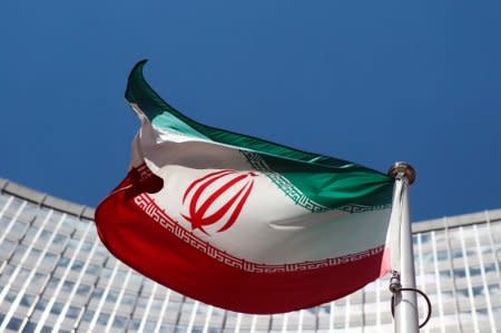 An Iranian flag flutters in front of the United Nations headquarters in Vienna June 17, 2014.  REUTERS/Heinz-Peter Bader