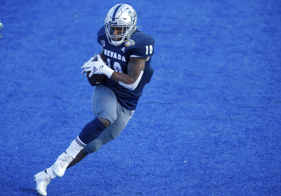 Nevada linebacker Lamin Touray (10) turns up field after intercepting a Tulane pass during the first half of the Idaho Potato Bowl NCAA college football game, Tuesday, Dec. 22, 2020, in Boise, Idaho. (AP Photo/Steve Conner)