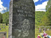 In this Tuesday, May 12, 2020, photo is the gravestone of Sid Hatfield, in Buskirk, Ky. Hatfield was the police chief in nearby Matewan, W.Va He was involved in a gunfight between miners and detectives hired by a coal company. Hatfield survived the May 19, 1920, gunfight that left 10 people dead but he was fatally shot a year later. (AP Photo/John Raby)