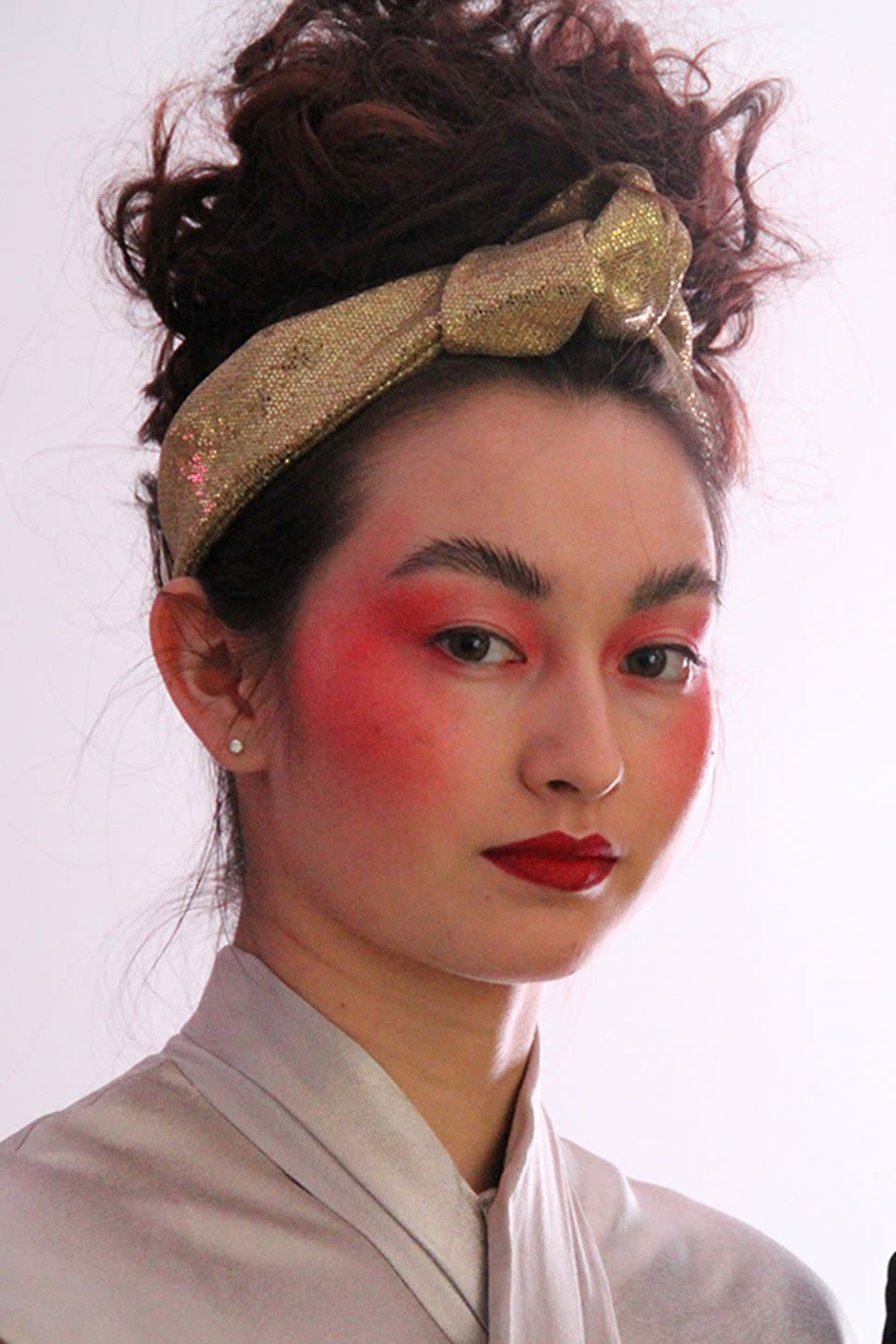 <p><strong>Trend: fall-out eyeshadow </strong></p><p>It was a case of escaping eyeshadow at Lulu Guinness, as a bold orangey pink shade cascaded across the models' eyes and cheeks. "The look is very 70’s and 80’s inspired with a pointy bright lip and pink on the cheeks, referencing the 1985 movie classic Desperately Seeking Susan", revealed Sam and Nic Chapman of Pixiwoo, who collaborated on the look with Bobbi Brown Pro Artist Amy Conway.</p><p>Bobbi Brown's <a rel="nofollow noopener" href="http://www.selfridges.com/GB/en/cat/bobbi-brown-art-stick_299-85076589-EA5T/?previewAttribute=Sunset+orange&cm_mmc=PLA-_-Google-_-BEAUTY-_-BOBBIBROWN&$&_$ja=tsid:35948%7ccid:198779374%7cagid:10881905254%7ctid:aud-86322337543:pla-74786670814%7ccrid:40370766334%7cnw:g%7crnd:254801660120754481%7cdvc:c%7cadp:1o1%7cmt:%7cloc:9072497&gclid=EAIaIQobChMIqZ7wpNq02QIVyyWBCh2bkwH4EAQYASABEgIt5vD_BwE&gclsrc=aw.ds" target="_blank" data-ylk="slk:Art Stick in Sunset Orange;elm:context_link;itc:0;sec:content-canvas" class="link ">Art Stick in Sunset Orange</a>, £22, was buffed out across the face using an <a rel="nofollow noopener" href="https://www.bobbibrown.co.uk/product/13995/43507/brushes-tools/eye-contour-brush?cm_mmc=GoogleBase-_-ShoppingFeed-_-BrushesTools-_-EyeContourBrush&77tadunit=08566737&77tadvert=230051762397&77tkeyword=&77tentrytype=s&77tentry=Shoppingcampaign_bobbibrown&cm_mmc=google-_-search_shopping-_-brand-_-&gclid=EAIaIQobChMI362pudq02QIV2BCBCh0SaA58EAQYAyABEgILy_D_BwE&gclsrc=aw.ds&dclid=CLLQo7vatNkCFRaadwodmL0AWg" target="_blank" data-ylk="slk:Eye Contour Brush;elm:context_link;itc:0;sec:content-canvas" class="link ">Eye Contour Brush</a>, £26.50, and, to match, the same shade was applied to the lips alongside <a rel="nofollow noopener" href="https://www.bobbibrown.co.uk/product/2343/32757/makeup/lips/lip-liner/lip-pencil#/shade/Sangria" target="_blank" data-ylk="slk:Lip Pencil in Sangria;elm:context_link;itc:0;sec:content-canvas" class="link ">Lip Pencil in Sangria</a>, £18. </p>