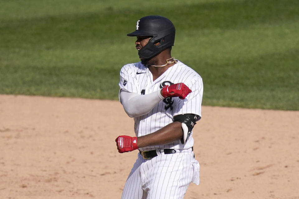 Chicago White Sox's Eloy Jimenez reacts on second after hitting an RBI double off Minnesota Twins relief pitcher Sergio Romo during the seventh inning of a baseball game, Thursday, Sept. 17, 2020, in Chicago. Yolmer Sanchez scored on the play. (AP Photo/Charles Rex Arbogast)