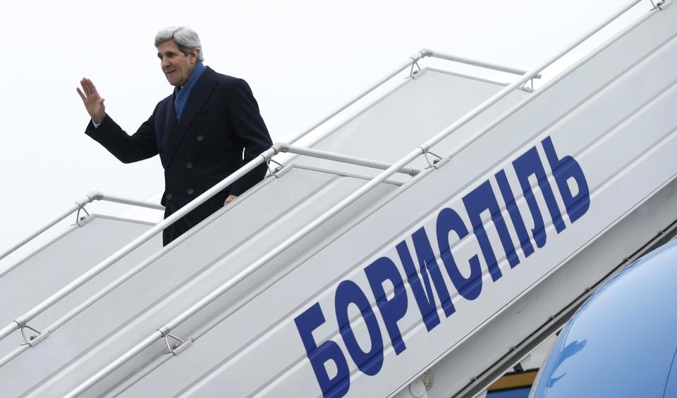 Secretary of State John Kerry arrives in Kiev, Ukraine, Tuesday, March 4, 2014. Kerry flew to Kiev to show U.S. support for the fledgling Ukraine government, and the Obama administration announced with his arrival a $1 billion energy subsidy package. The fast-moving developments came as the United States readied economic sanctions amid worries that Moscow was ready to stretch its military reach further into the mainland of the former Soviet republic. (AP Photo/Kevin Lamarque, Pool)