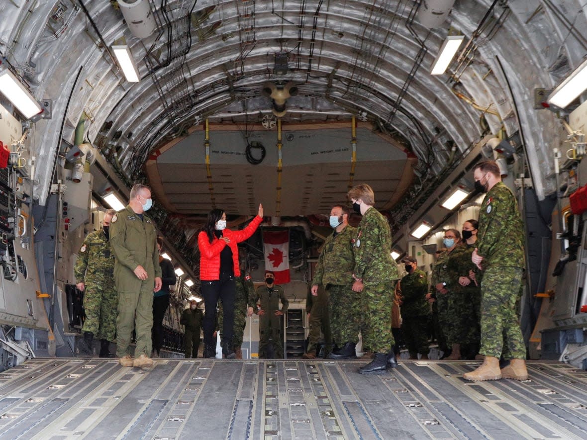 Defence Minister Anita Anand speaks with Canadian military personnel onboard a transport plane during a visit to highlight military aid for Ukraine at Canadian Forces Base Trenton in Trenton, Ont., April 14, 2022. (Lars Hagberg/Reuters - image credit)