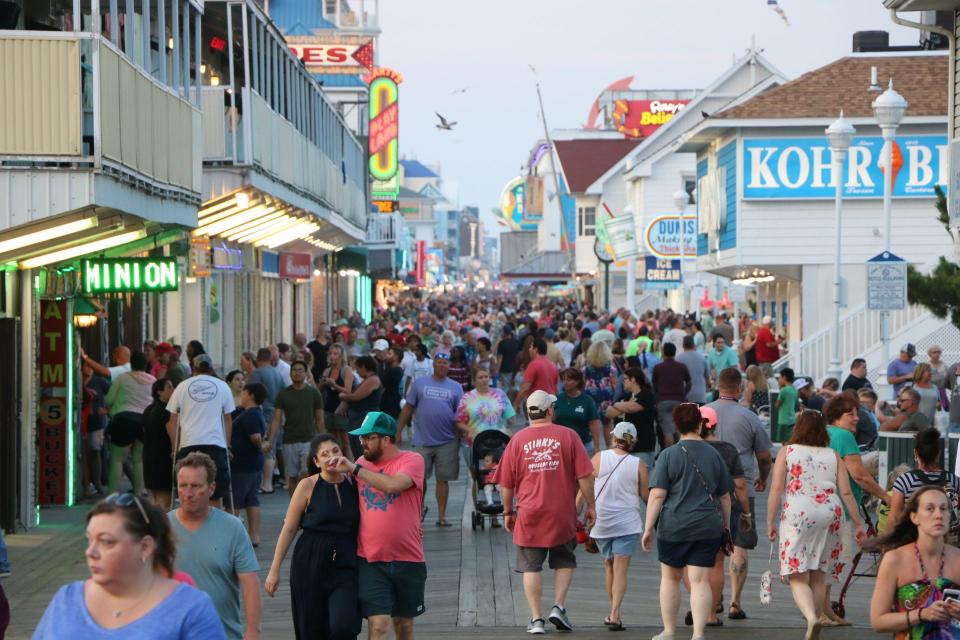 Crowds walk along the Ocean City boardwalk near the Ocean City Life-Saving Station Museum on Aug. 22, 2019. Business owners say late August is one of the busiest times for tourism in Ocean City.