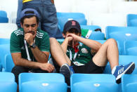 <p>Mexico fans look dejected after the match REUTERS/Pilar Olivares </p>