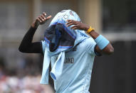 England's Jofra Archer wears his jersey after bowling an over during the Cricket World Cup match between England and Pakistan at Trent Bridge in Nottingham, Monday, June 3, 2019. (AP Photo/Rui Vieira)