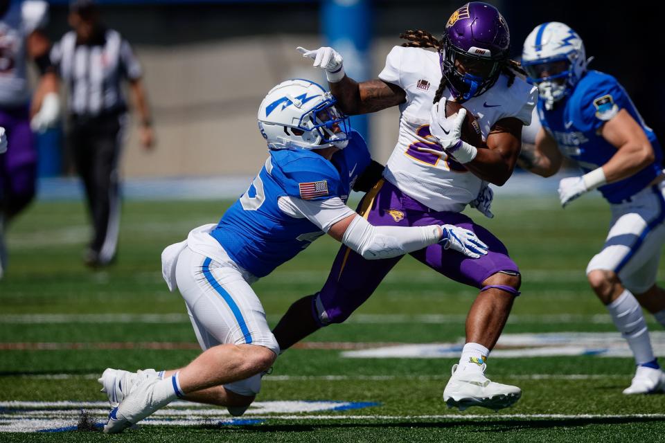 Sep 3, 2022; Colorado Springs, Colorado, USA; Northern Iowa Panthers defensive back Ethan Copeland (25) is tackled by Air Force Falcons linebacker Matt Devine (45) in the fourth quarter at Falcon Stadium.