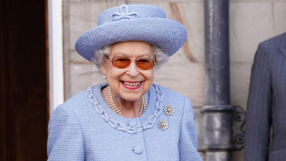 Queen Elizabeth II smiles as she attends the Queen's Body Guard for Scotland (also known as the Royal Company of Archers) Reddendo Parade in the gardens of the Palace of Holyroodhouse