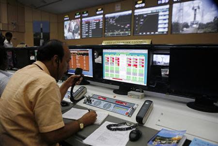 A technician monitors the functions of India's Polar Satellite Launch Vehicle (PSLV-C25), carrying the Mars orbiter, before its launch at Satish Dhawan Space Centre in Sriharikota, about 100 km north of Chennai October 30, 2013. REUTERS/Stringer