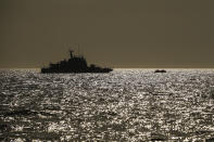 A Turkish coast guard vessel approaches a life raft with migrants in the Aegean Sea, between Turkey and Greece, Saturday, Sept. 12, 2020. Turkey is accusing Greece of large-scale pushbacks at sea — summary deportations without access to asylum procedures, in violation of international law. The Turkish coast guard says it rescued over 300 migrants "pushed back by Greek elements to Turkish waters" this month alone. Greece denies the allegations and accuses Ankara of weaponizing migrants.(AP Photo/Emrah Gurel)