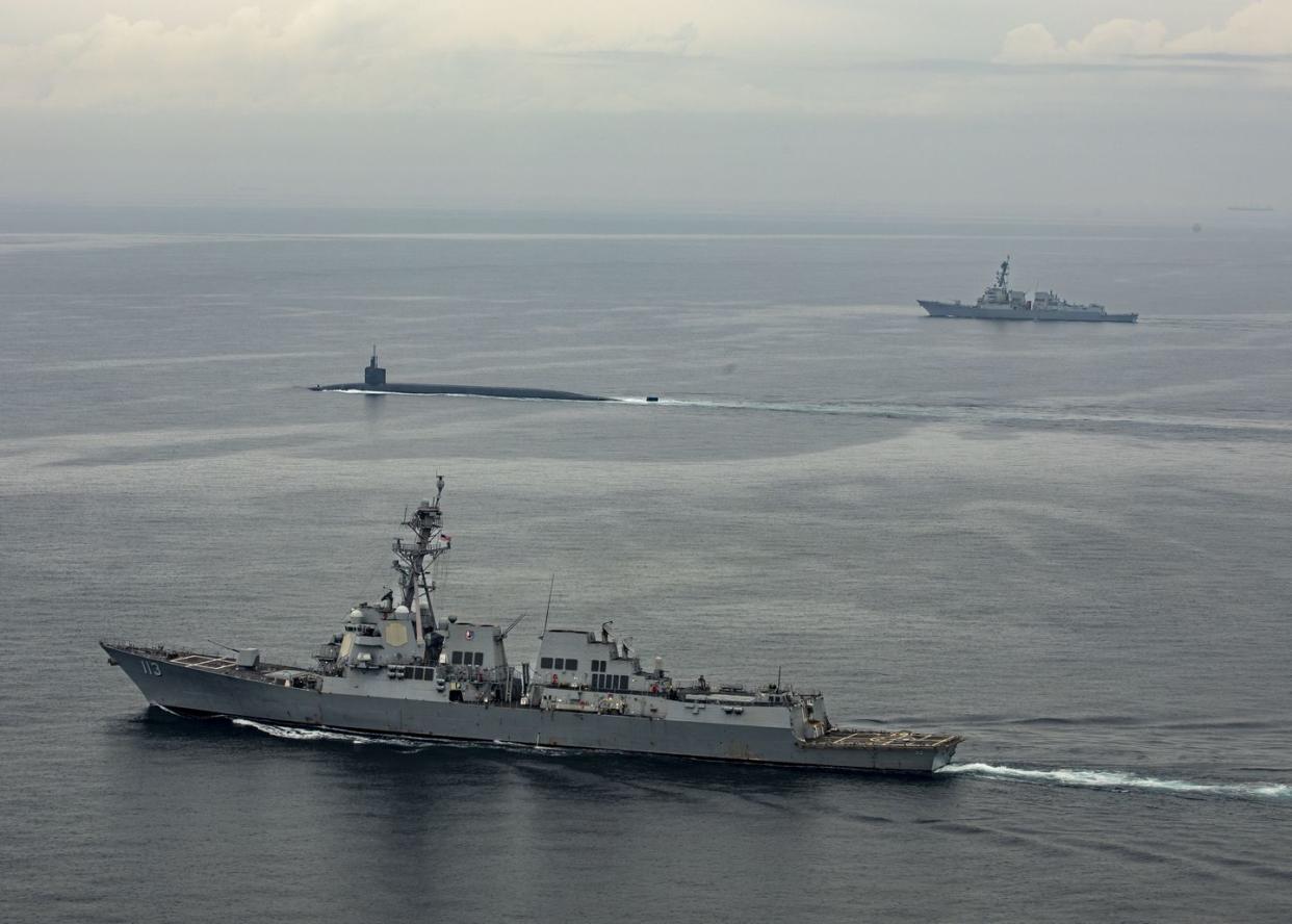 ohio class ssbn submarine kentuck at busan escorted by two destroyers