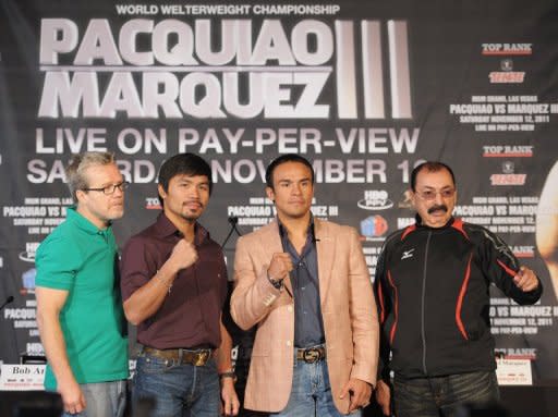 (From L) Pacquiao's trainer Freddie Roach, boxers Manny Pacquiao and Juan Manuel Marquez, and Marquez's trainer Ignacio Beristain, seen here during a press conference in September, ahead of Pacquiao vs Marquez's World Welterweight Championship fight, in New York