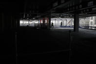 Construction workers putting down the steel flooring over the beams at the 8 Bishopsgate development in London, Thursday, April 1, 2021. When the pandemic struck, about 540,000 workers vanished from London's financial hub almost overnight. Developers of 8 Bishopsgate, are confident that when construction ends late next year, workers and firms will return to fill all 50 floors of the gleaming new office space. (AP Photo/Alastair Grant)