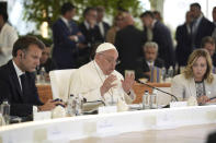 From left, French President Emmanuel Macron, left, and Italy's Prime Minister Giorgia Meloni, right, listen to Pope Francis speaking during a working session on Artificial Intelligence (AI), Energy, Africa-Mediterranean, on day two of the 50th G7 summit at Borgo Egnazia, southern Italy, on Friday, June 14, 2024. (Christopher Furlong/Pool Photo via AP)