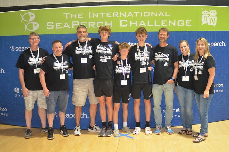 This was the first year a Clinton Middle School team reached the international competition. Team Dandruff with parents and coaches (left to right): Ted Pizio, Jerry Manchester, Mike Krauss, Cole Hillegonds, Broden Manchester, Jacob Pizio, Kurt Hillegonds, Natalie Manchester and Dawn Pizio did not disappoint. The highlight of the team’s performance was a fourth-place finish in the obstacle course, a mere 0.06 seconds out of the third-place trophy finish.