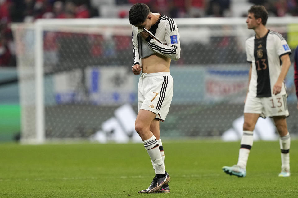 Germany's Kai Havertz, left, and Germany's Thomas Mueller react aftere the World Cup group E soccer match between Costa Rica and Germany at the Al Bayt Stadium in Al Khor , Qatar, Thursday, Dec. 1, 2022. (AP Photo/Martin Meissner)