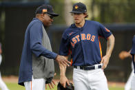 Houston Astros manager Dusty Baker, left, talks with pitcher Chris Devenski during spring training baseball practice Thursday, Feb. 13, 2020, in West Palm Beach, Fla. (AP Photo/Jeff Roberson)