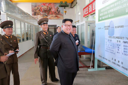 North Korean leader Kim Jong-Un smiles during a visit to the Chemical Material Institute of the Academy of Defense Science in this undated photo released by North Korea's Korean Central News Agency (KCNA) in Pyongyang on August23, 2017. KCNA/via REUTERS