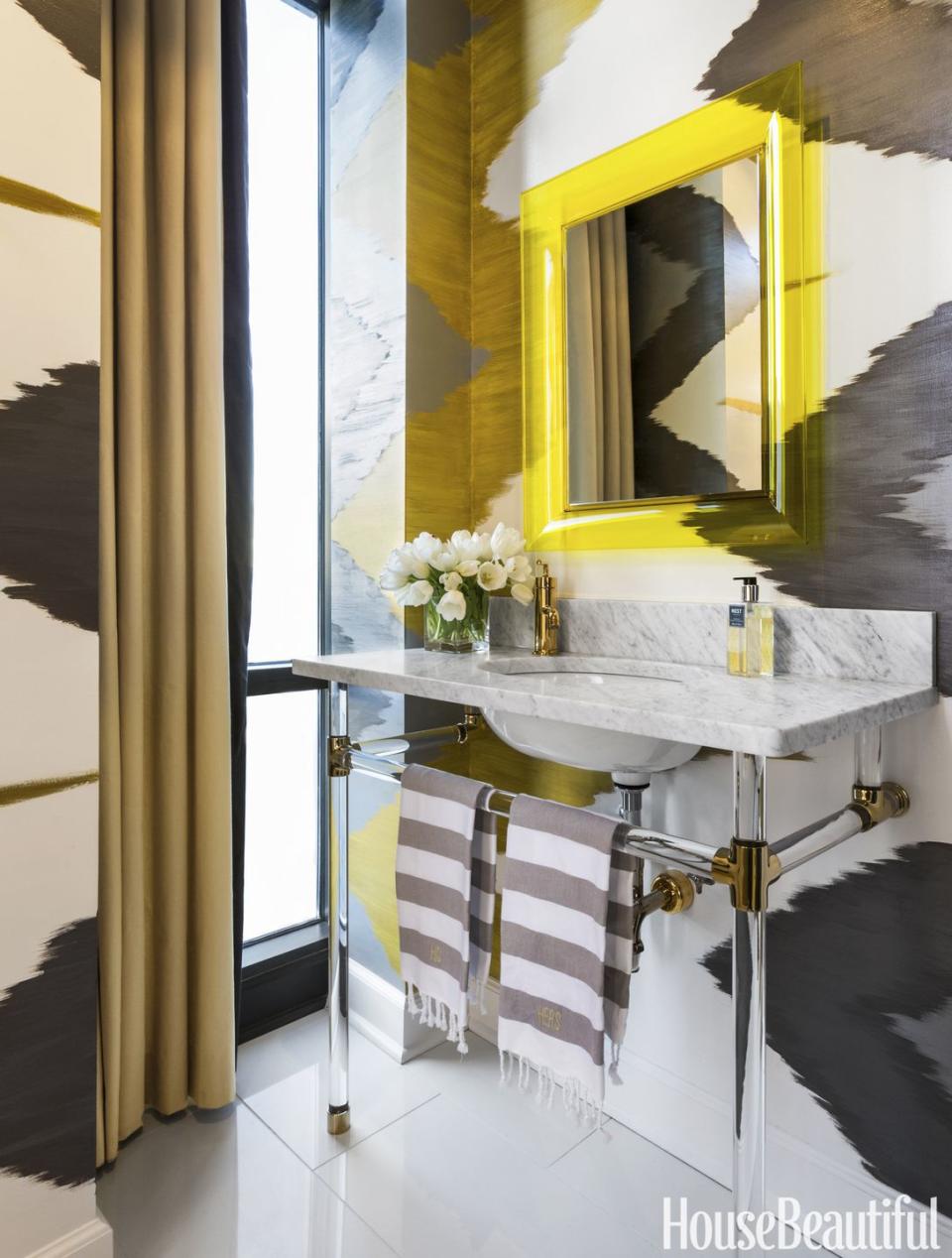 <p>Since there's no need to stash everyday necessities under a powder room sink, the vanity is liberated from its storage task and becomes strictly a statement piece. A Lucite-framed mirror in a zingy yellow continues the theme of transparency.</p>