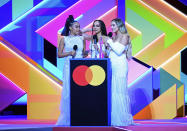 Little Mix accept the award for Best British Group during the Brit Awards 2021 at the O2 Arena, London, Tuesday, May 11, 2021. (Ian West/PA via AP)