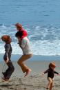 <p>Dame Maggie Smith jumps rope in the sand while spending the day with her family in 1971.</p>