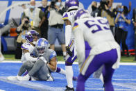 Detroit Lions wide receiver Amon-Ra St. Brown (14), defended by Minnesota Vikings cornerback Cameron Dantzler (27) catches a 11-yard pass for a touchdown to end the NFL football game, Sunday, Dec. 5, 2021, in Detroit. (AP Photo/Duane Burleson)