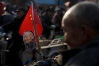 A retired worker watches a Chinese opera performance that Xinyuan Steel put on to mark the end of Chinese New Year festivities in Anyang, Henan province, China, February 19, 2019. REUTERS/Thomas Peter