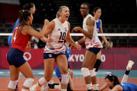 United States' Justine Wong-Orantes, from left, United States' Jordan Larson and United States' Foluke Akinradewo celebrate winning a point during the women's volleyball preliminary round pool B match between China and United States at the 2020 Summer Olympics, Tuesday, July 27, 2021, in Tokyo, Japan. (AP Photo/Frank Augstein)