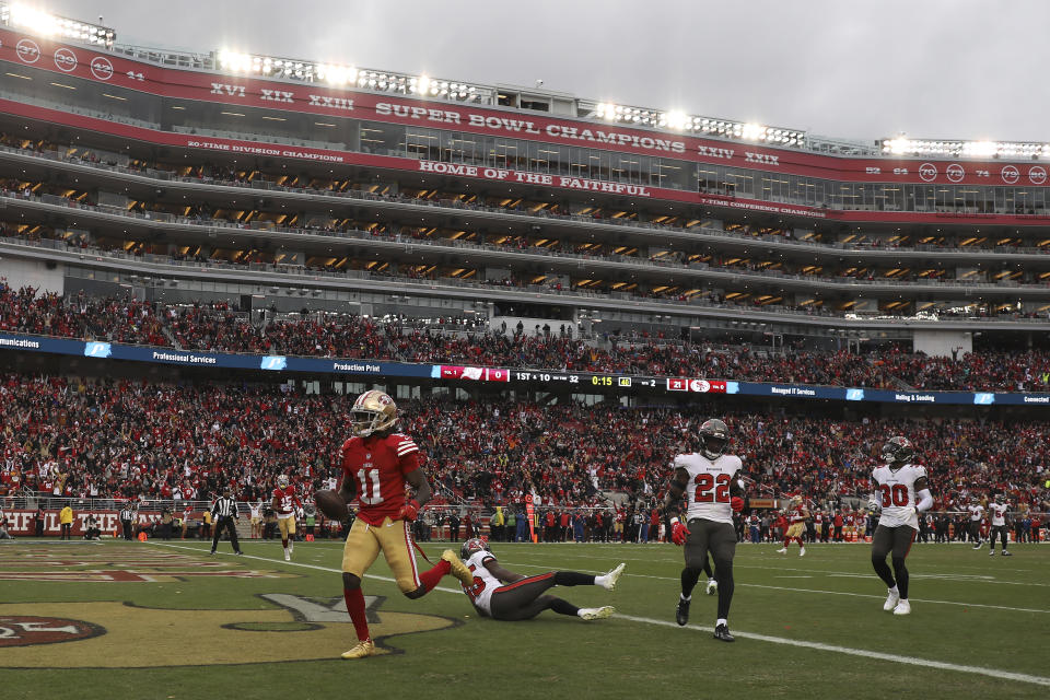 San Francisco 49ers wide receiver Brandon Aiyuk (11) runs into the end zone after scoring a touchdown against the Tampa Bay Buccaneers during the first half of an NFL football game in Santa Clara, Calif., Sunday, Dec. 11, 2022. (AP Photo/Jed Jacobsohn)