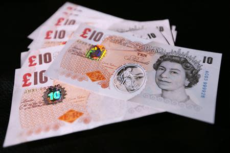 Sample polymer ten GB pound banknotes are seen on display at the Bank of England in London September 10, 2013. REUTERS/Chris Ratcliffe/pool