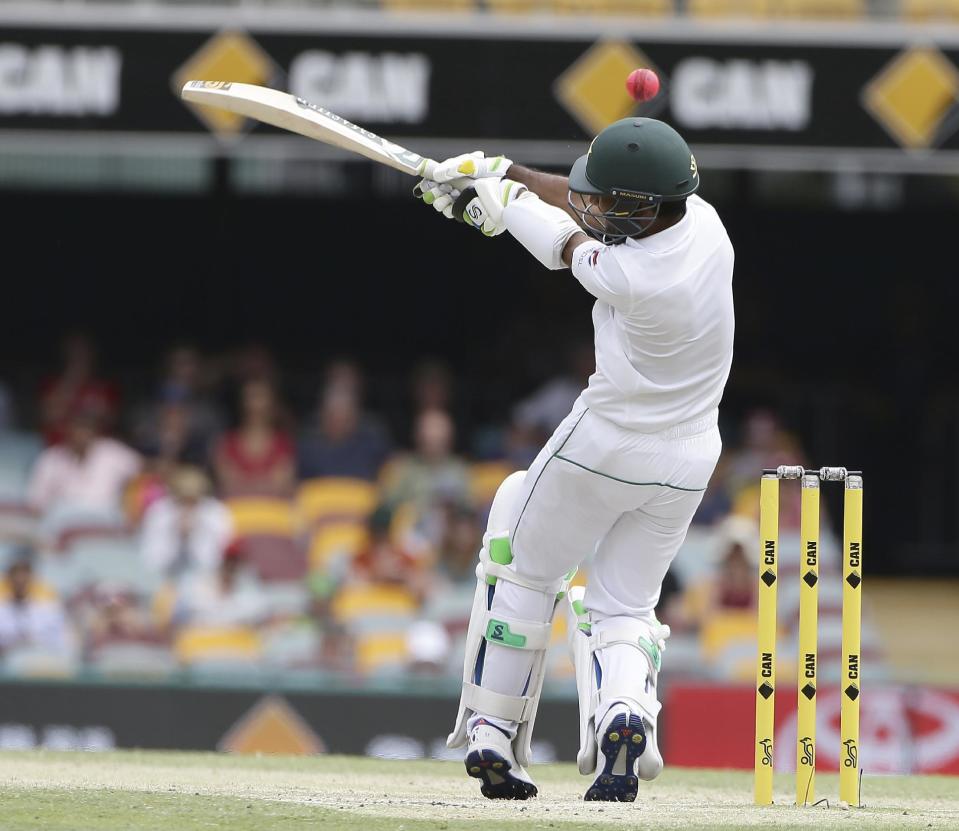 Pakistan's Asad Shafiq misses a shot during play on the final day of the first cricket test between Australia and Pakistan in Brisbane, Australia, Monday, Dec. 19, 2016. (AP Photo/Tertius Pickard)