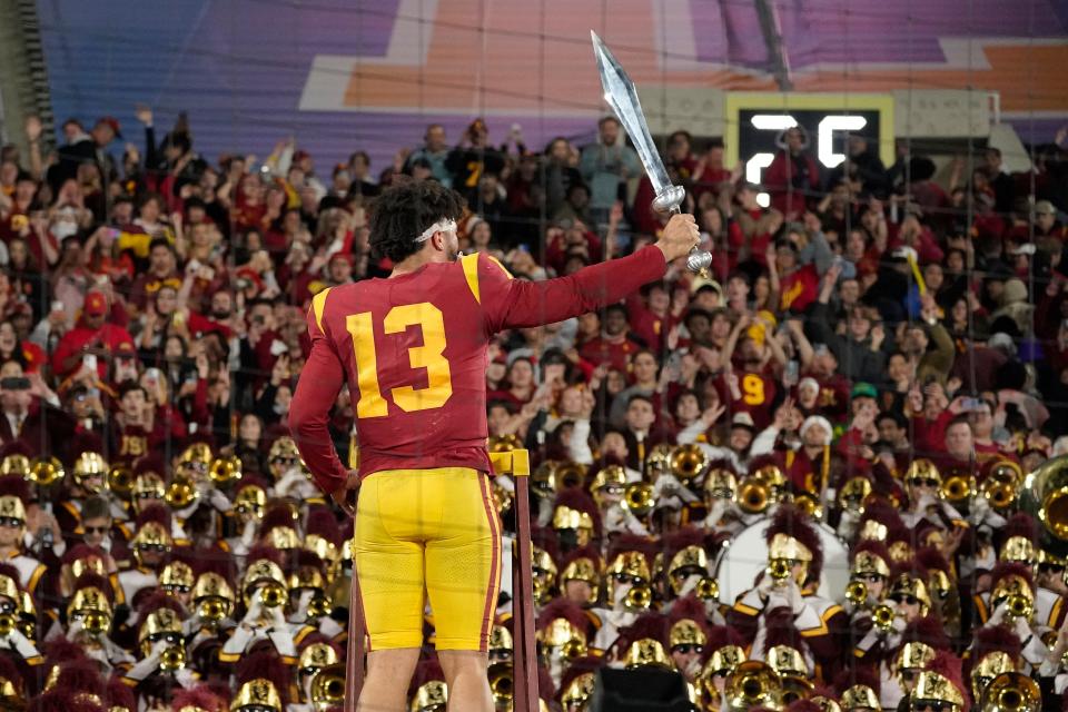 Caleb Williams directs the Southern Cal marching band after the Trojans beat UCLA 48-45 on November 19. MARK J. TERRILL/The Associated Press